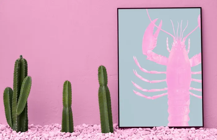 三棵绿色仙人掌和粉红色的蟹鱼画