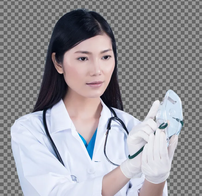 身着制服、带听诊器、橡胶手套、医疗医院氧气面罩的亚洲美女医生护士女人，肖像组成黑色直发，工作室照明蓝色背景复制空间