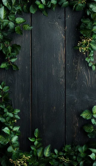 绿叶边框黑色木纹背景