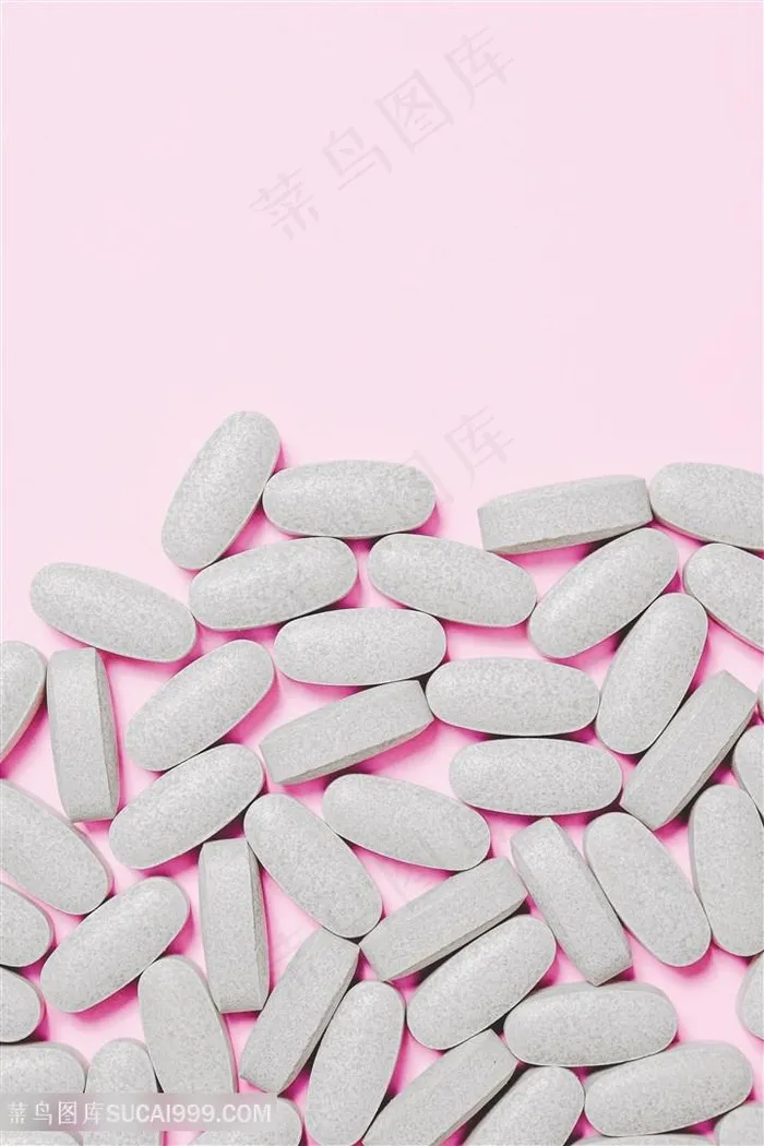 粉色背景与灰白色药片医药图片