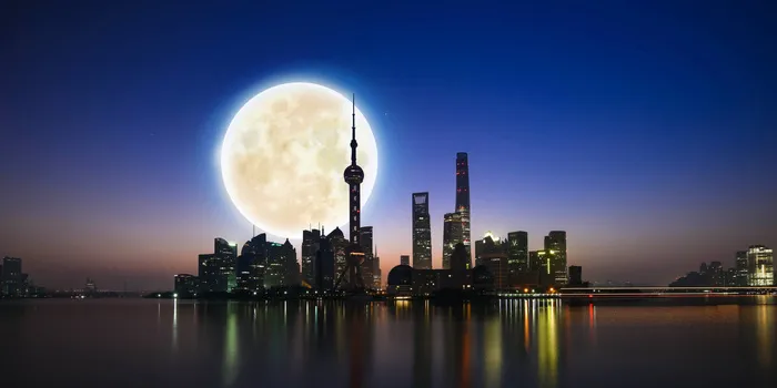 上海蓝色建筑优美夜景中秋节创意背景