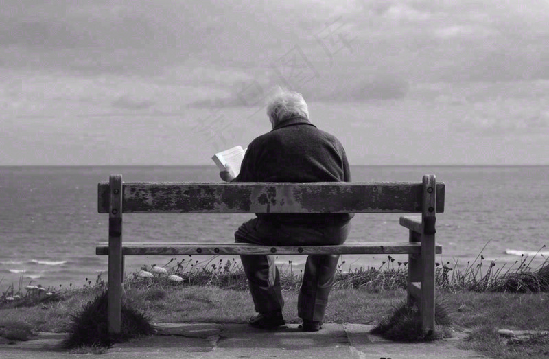 黑白简约坐着海边长椅看书的老人白发重阳节父亲节摄影图